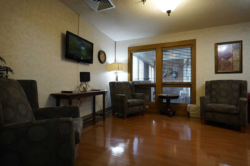 Sofa and television in resident lounge- Arbors at Pomeroy